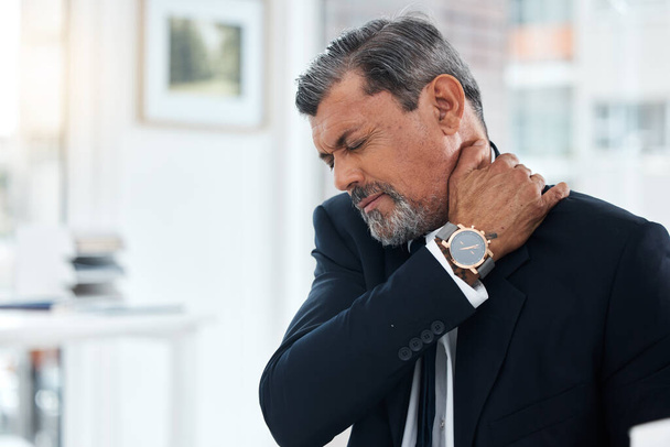 Business, stress and mature man with neck pain, tired and burnout of health problem, anxiety and bad posture. CEO, corporate boss and executive with spine injury, muscle fatigue and risk of arthritis. - Photo, Image
