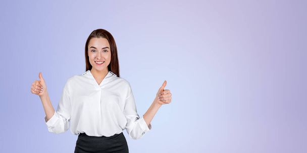 Happy businesswoman showing thumbs up, looking at the camera successful portrait copy space gradient background. Concept of feedback, recommend and best service - Photo, image