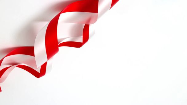 Red and white ribbons with empty copy space on white background. Indonesia Independence Day concept - Photo, Image