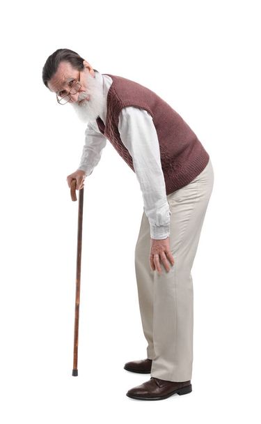 Stooped senior man with walking cane on white background - Foto, Imagem