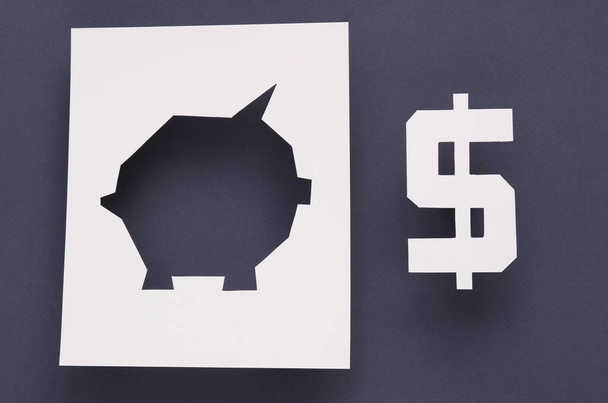 Papírgödör alakú malacpersely és dollár szimbólum szürke háttérrel. Üzleti koncepció - Fotó, kép