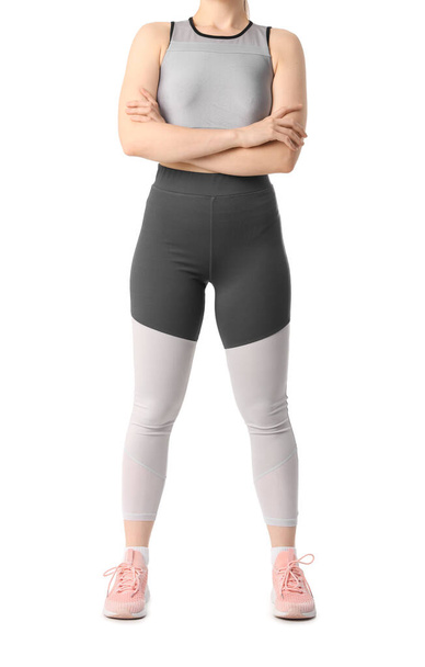 Young woman in sportswear on white background - Photo, Image