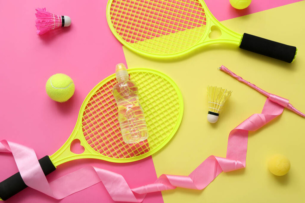 Composition with bottle of water and different sports equipment on color background - Photo, Image