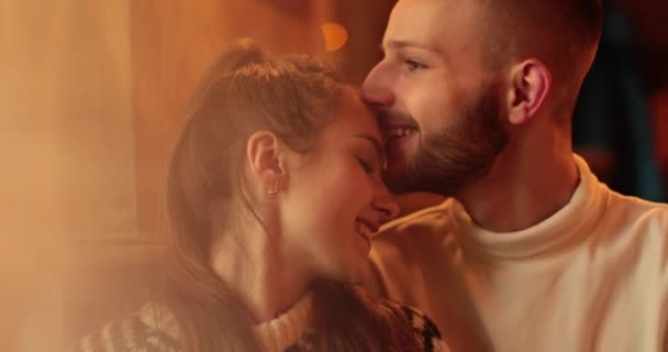 Young carefree romantic happy couple in love in cafeteria. Kisses, hugs and romance in a caYoung carefree romantic happy couple in love in cafeteria. Kisses, hugs and romance in a cafe on a romantic date of a couple in love.fe on a romantic date. - Footage, Video