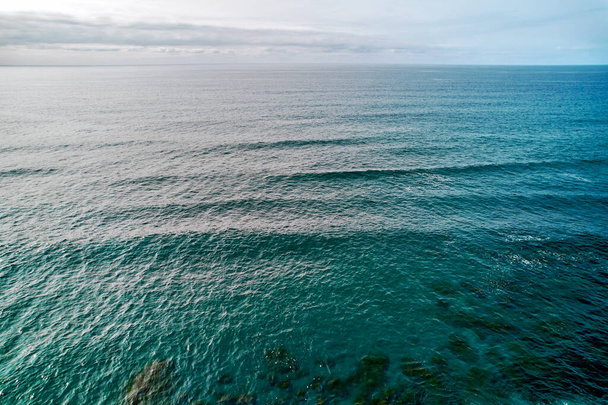 Aerial shot, drone point of view of calm waters of the Atlantic Ocean. San Miguel, Ponta Delgada Island. Azores, Portugal. Travel and tourism concept - Фото, зображення