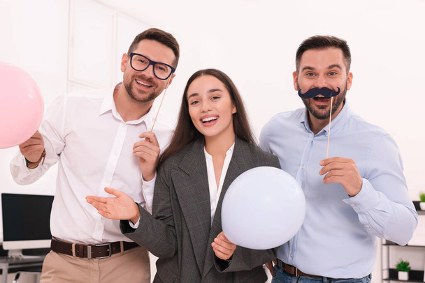 Coworkers having fun during office party indoors - Photo, image