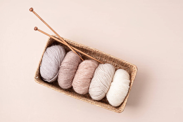Craft knitting hobby background with yarn in natural colors. Recomforting hobby to reduce stress for cold fall and winter weather. - Valokuva, kuva