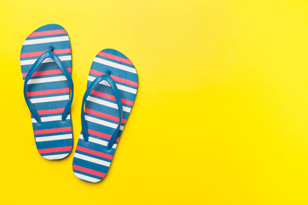 Bright flip flops on color background, top view - Fotografie, Obrázek