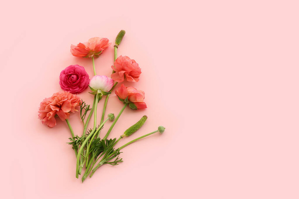 Top view image of pink flowers composition over pastel background - Fotó, kép