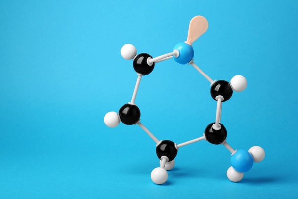 Structure of molecule on light blue background, space for text. Chemical model - Foto, immagini