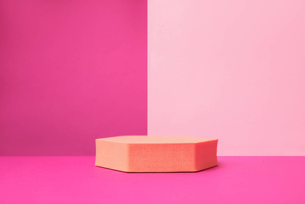 Orange geometric stand on pink background. Stylish presentation for product - Foto, Imagem