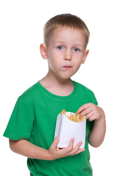 Cute little boy with fries - Zdjęcie, obraz
