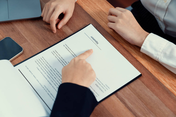 Closeup business deal meeting, young businesswomen carefully reviewing terms and condition of contract agreement papers in office. Corporate lawyer give consultation on contract deal. Enthusiastic - Foto, Imagem