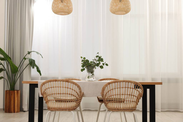 Stylish dining room with cozy furniture and plants - Φωτογραφία, εικόνα
