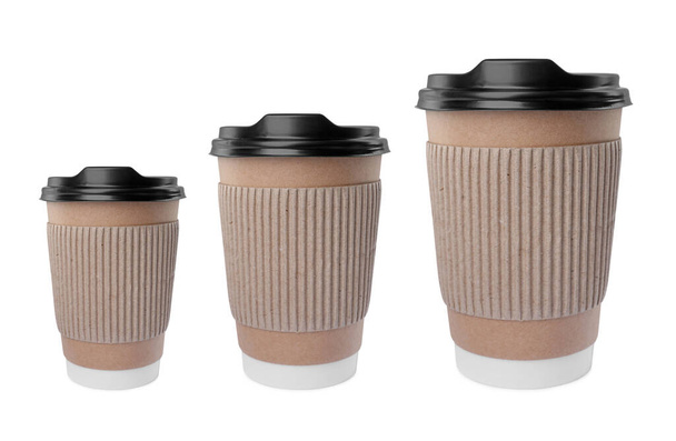 To-go drink. Set with three paper coffee cups of different sizes isolated on white - Foto, immagini