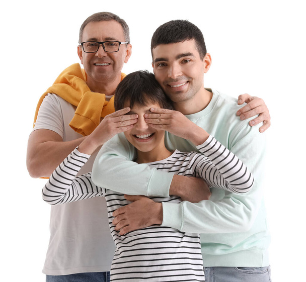Happy little boy with his dad and grandfather on white background - Photo, Image