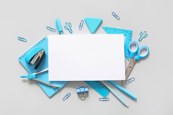 Composition with blank paper sheet and different school stationery on white background - Photo, Image