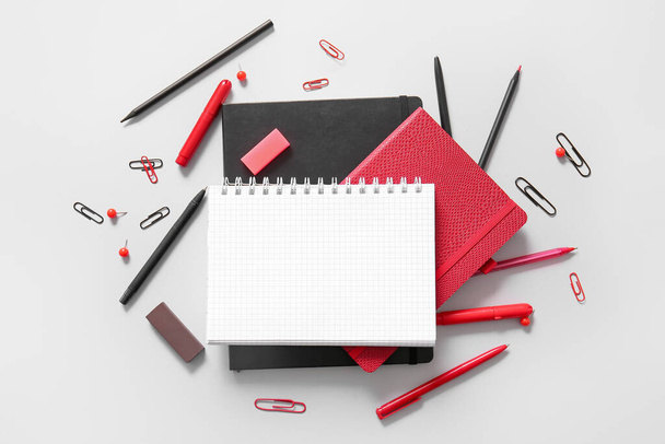 Composition with blank notebook and different school stationery on white background - Valokuva, kuva