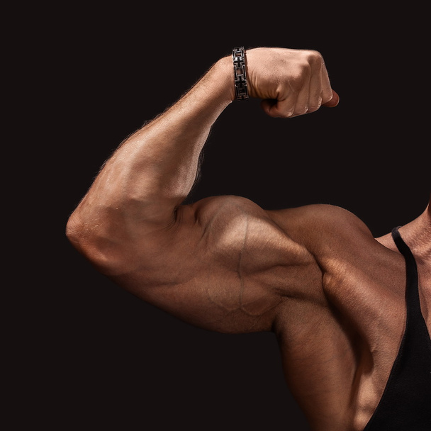 Close up of man's arm showing biceps - Фото, зображення