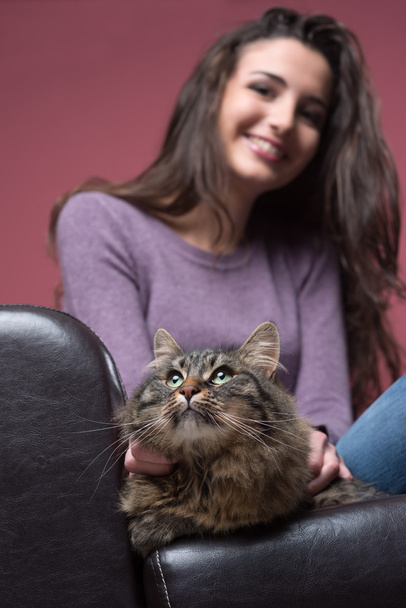 Young woman cuddling a cat - Photo, Image
