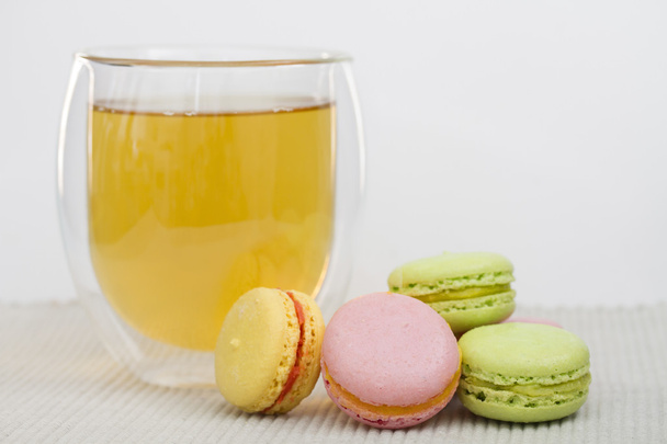 Macaroon and glass cup of green tea - Photo, Image