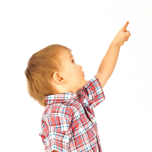 Portrait of happy little boy over white background looking away - Фото, зображення