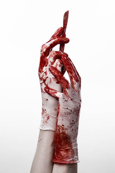 Bloody hands in gloves with the scalpel, white background, isolated, doctor, killer, maniac - Фото, зображення