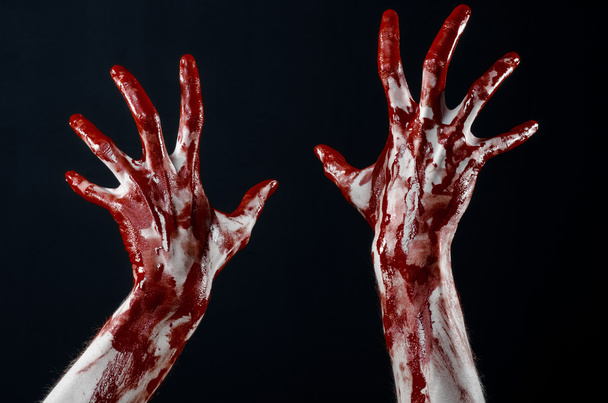 Bloody hands in white gloves, a scalpel, a nail, black background, zombie, demon, maniac - Foto, Imagen