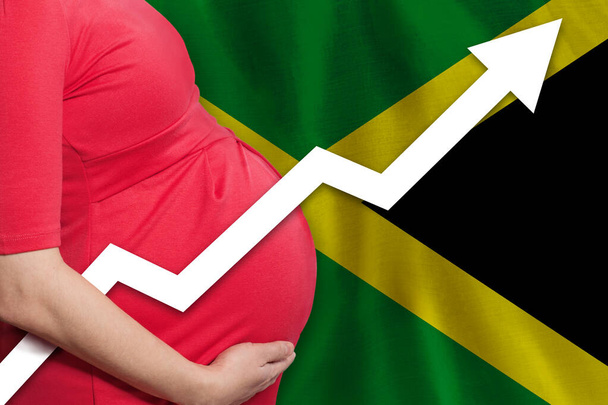 Mujer embarazada en la bandera de Jamaica antecedentes. Tasa de natalidad - Foto, imagen
