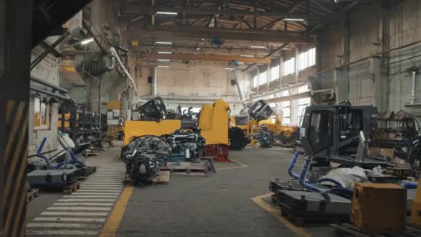 No people dolly shot of modern big tractor plant producing crawler tractors, bulldozers and other machines - Footage, Video