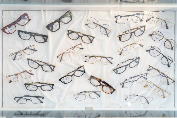 Showcases with glasses in optics. March 1, 2023 Beltsy, Moldova. For illustrative editorial use. - Photo, Image