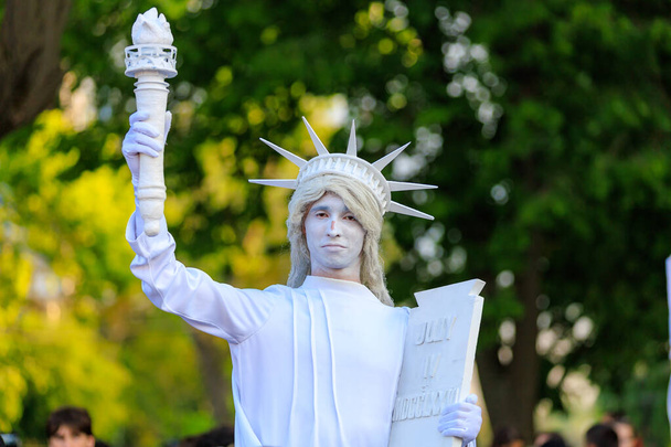 May 19, 2023 Beltsy, Moldova. For illustrative editorial use. Living sculpture of the Statue of Liberty. American Culture Days Celebration - Photo, Image