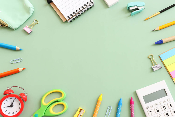 Back to school concept on pastel green background. Top view - Φωτογραφία, εικόνα