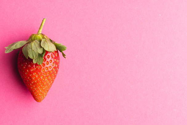Close up of strawberry and copy space on pink background. Fruit, berry, food, freshness and colour concept. - Photo, Image