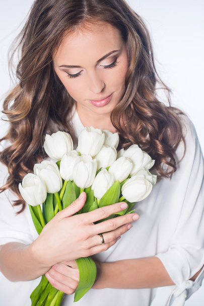 Woman with pulip flowers - Foto, imagen