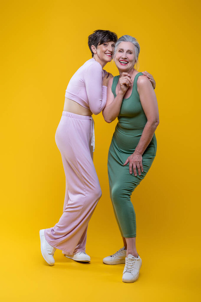 Femininity. Two good-looking senior women feeling excited - Fotó, kép