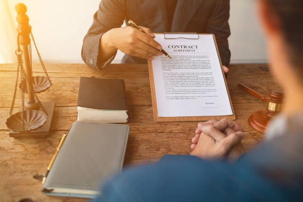 contract of sale was placed on the table in the lawyer office because the company hired the lawyer office as a legal advisor and drafted the contract so that the client could sign the right contract. - Photo, Image