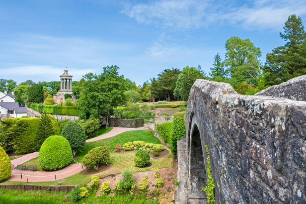 Burns Memorial and free gardens in Alloway near Ayr Scotland about to celebrate its 200th anniversary Image taken from the Auld Brig looking over to the gardens. - Photo, Image