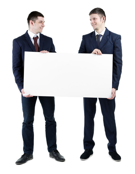 Two handsome businessmen holding blank poster isolated on white - Фото, зображення