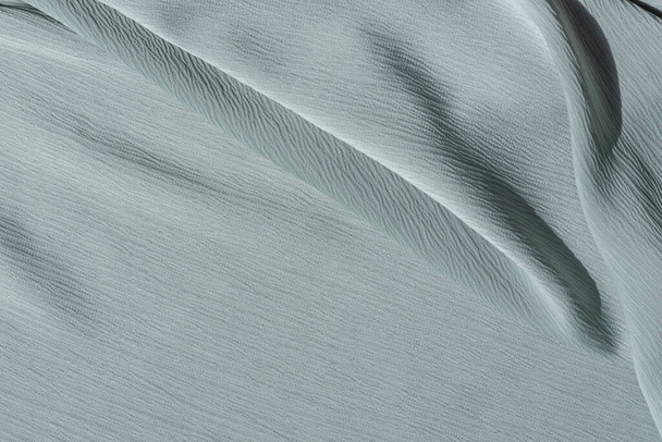 Нейтральна текстура світло-блакитної тканини з абстрактними складками, естетичний мінімалістичний витягнутий текстильний фон, шаблон бізнес-бренда - Фото, зображення