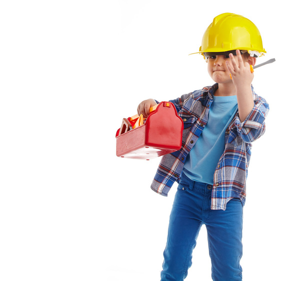 Little boy plays construction worker. Isolated on white - Фото, зображення
