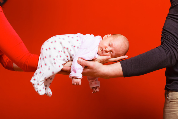 newborn baby girl in the comfort of moms arms - 写真・画像