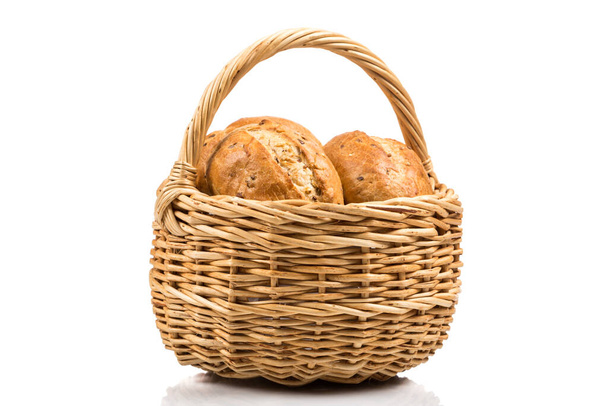 Bun bread in wicker basket isolated on white background - 写真・画像