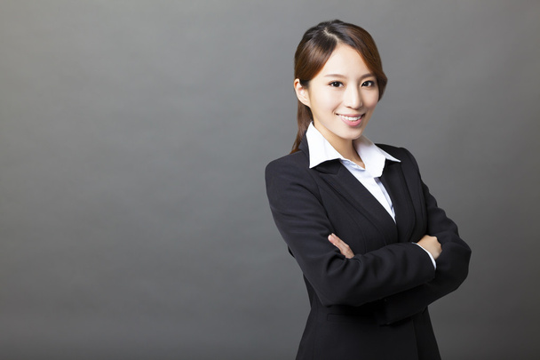 schöne asiatische Geschäftsfrau Porträt mit grauem Hintergrund - Foto, Bild