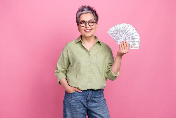 Photo of pretty cheerful person hand hold hundred dollar bills banknotes isolated on pink color background. - Fotoğraf, Görsel