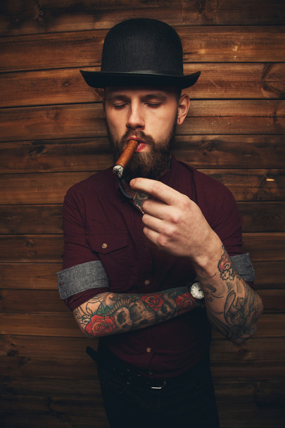 Brutal tattooed male with cigar - Photo, Image