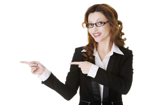 Businesswoman pointing to the left. - Photo, image