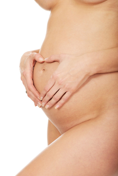 Pregnant woman's belly - Foto, afbeelding