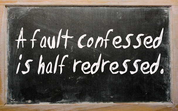 "A fault confessed is half redressed" written on a blackboard - Photo, Image