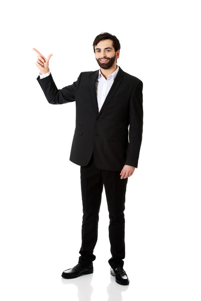 Businessman points his finger up. - Фото, зображення